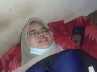 A pretty girl wearing a hijab gives oral and engages in intercourse