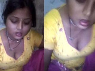 A lovely girl displays her creamy bosom while dining