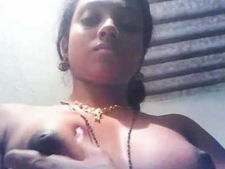 Aroused Tamil woman fondles her firm breasts and nipples