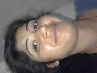 Young woman displays breasts and moist vagina while pleasuring herself