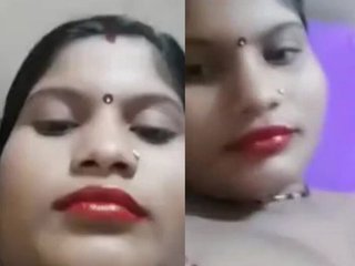 A charming Indian bhabi shows off her ample bosom