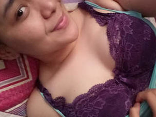 Desi girl in hijab reveals her breasts and engages in sexual activity