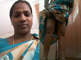 Indian aunt's steamy bathroom scene with peeing element