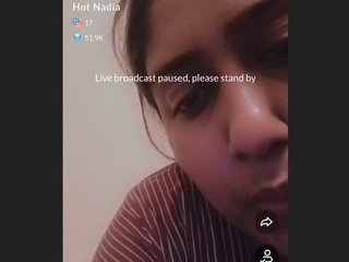 Nadia's super-sized breasts take center stage in this steamy video