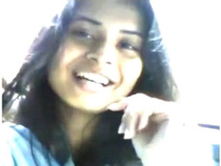 A young Indian woman enjoys giving oral sex in a car