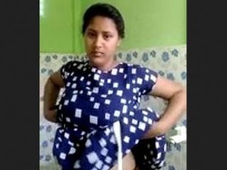 Beautiful Indian wife beautifies her face before bath