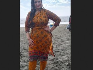 Stunning mature woman relaxes in a hot bath