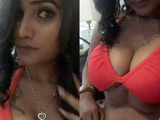 A busty Indian model flaunts her curves in a swimsuit