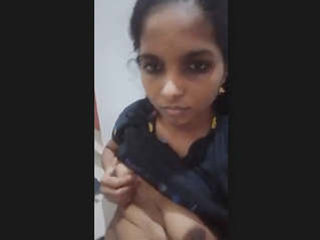 Andhra woman displays her petite chest in front of the camera