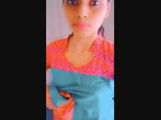 A charming girl reveals her intimate parts