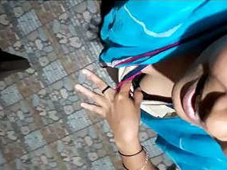 A young Indian woman engages in intimate activities with a man