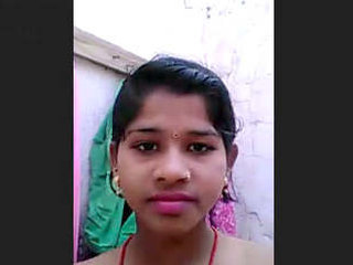 Attractive country girl reveals her breasts and genitalia