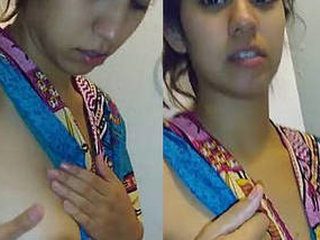 Watch a stunning Asian girl with big boobs get them pressed