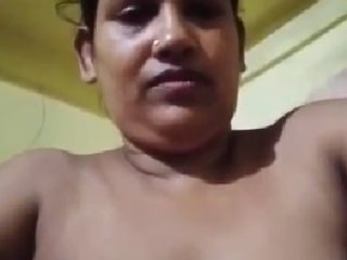 Desi aunty pleasures herself with her fingers in a village setting