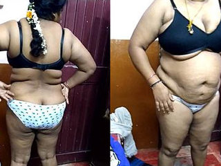 Desi aunty flaunts her curves in a solo video