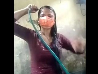 Desi teen in a sexy bathing suit takes a bath in the village