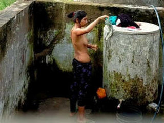 Desi girl takes a bath behind the door in part 2